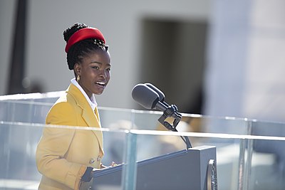 Amanda Gorman recites her inaugural poem, The Hill We Climb, during the 59th Presidential Inauguration ceremony in Washington, Jan. 20, 2021. President Joe Biden and Vice President Kamala Harris took the oath of office on the West Front of the U.S. Capitol. (DOD Photo by Navy Petty Officer 1st Class Carlos M. Vazquez II)