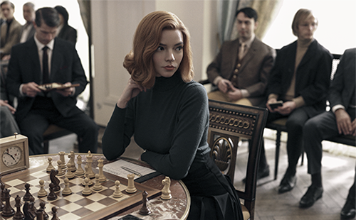 Beth Harmon, a chess player, stares into the wild during one of her rounds. 