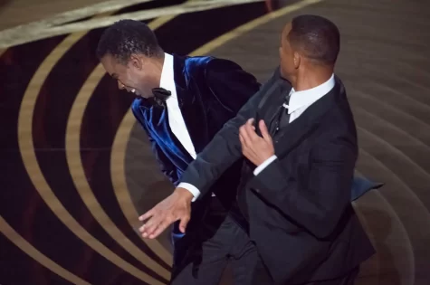 Close up image of Will Smith slapping Chris Rock