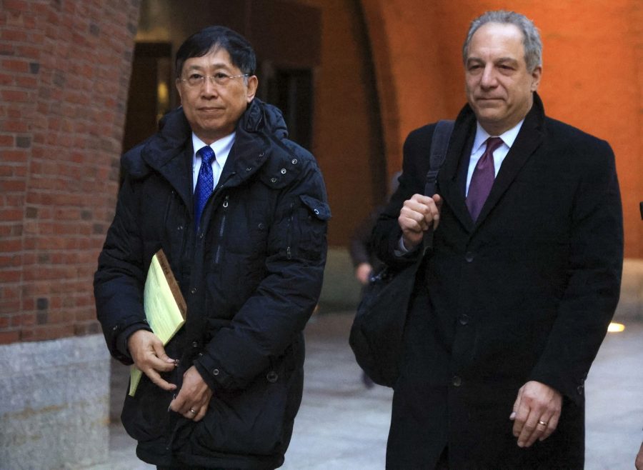 Jack Zhao (left) departing the federal court in Boston