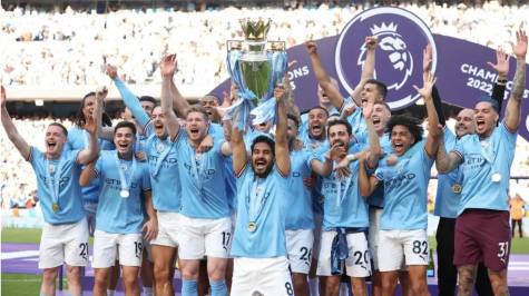 Manchester City’s captain Ilkay Gündogan lifts the Premier League title. Photograph: Getty Images 