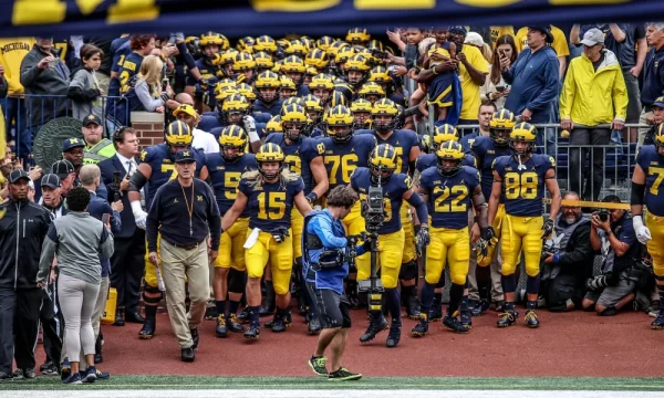 The Michigan Wolverines storming the football field 