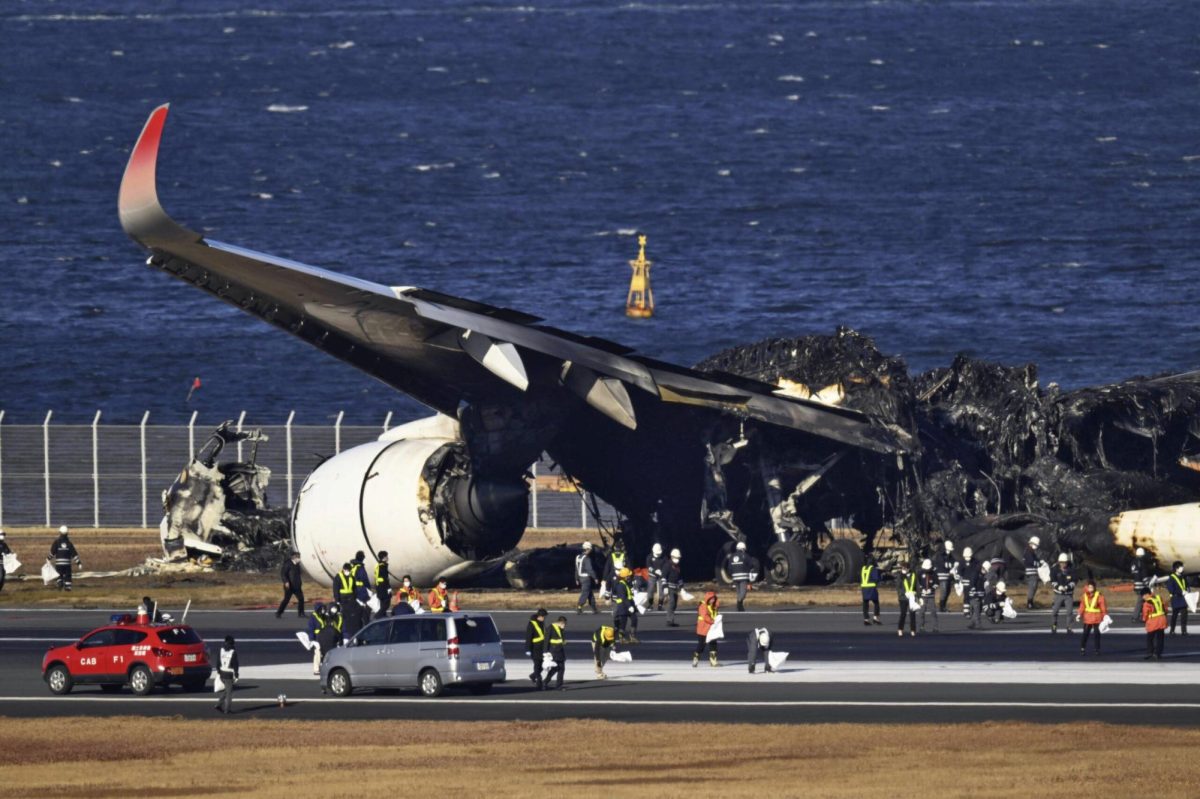 Aftermath of the collision at Haneda Airport, from Kyodo News