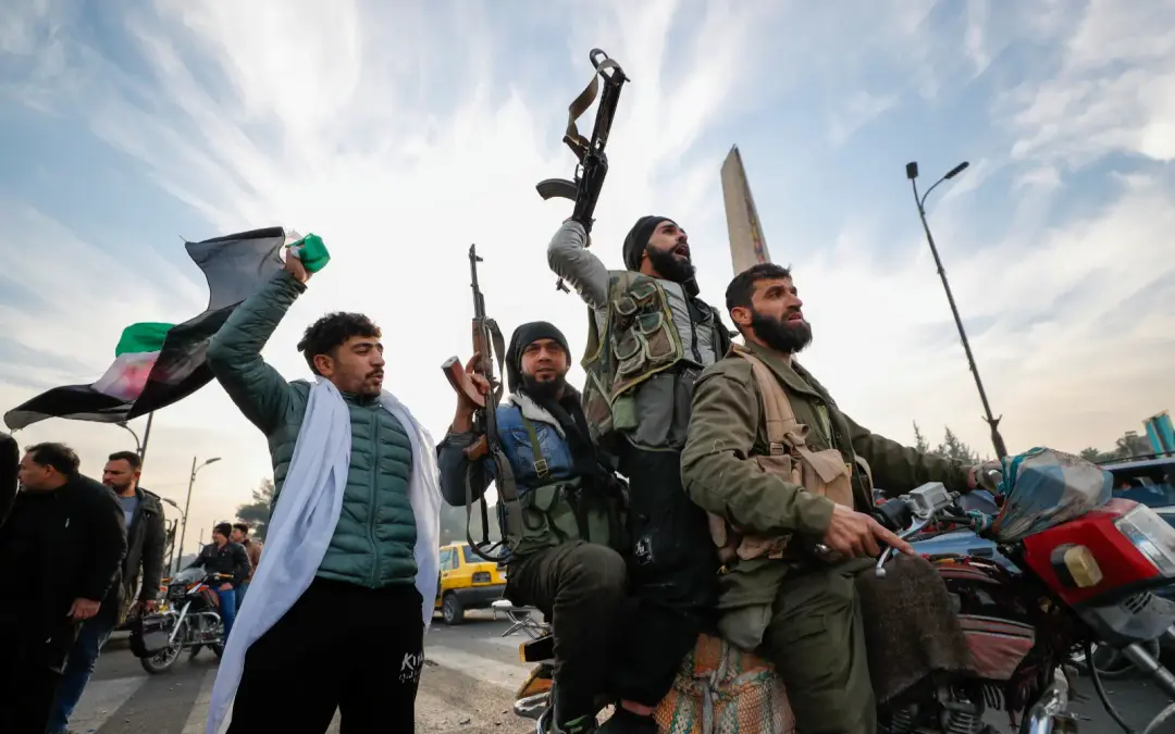 "Opposition fighters shoot in the air as they celebrate in Damascus. (AP Pic)" 