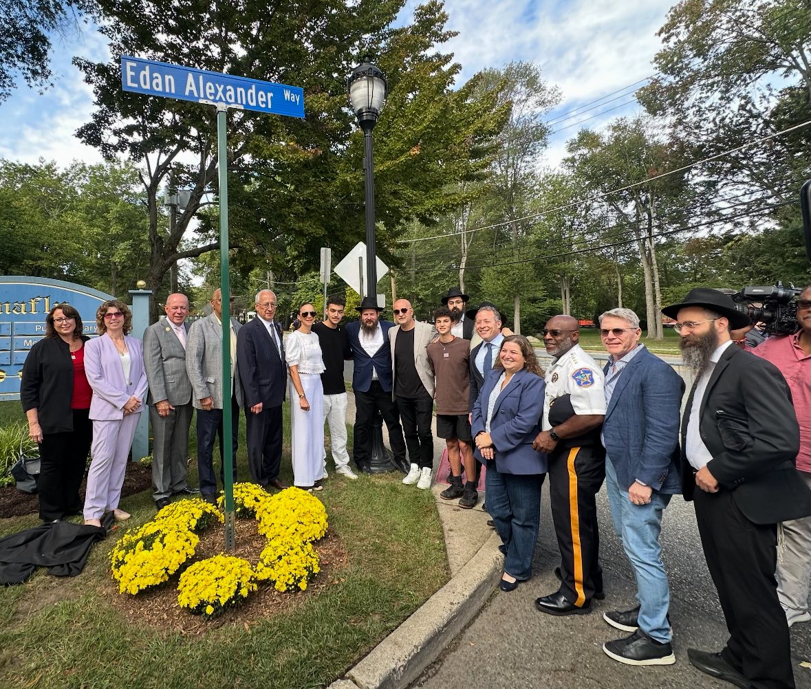 Edan Alexander and his family at the street-naming ceremony in his honor.