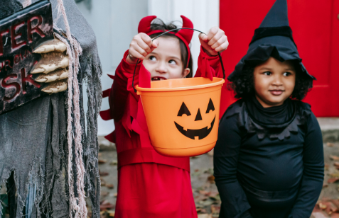 https://www.pexels.com/photo/multiracial-kids-in-halloween-costumes-near-decorations-5859379/