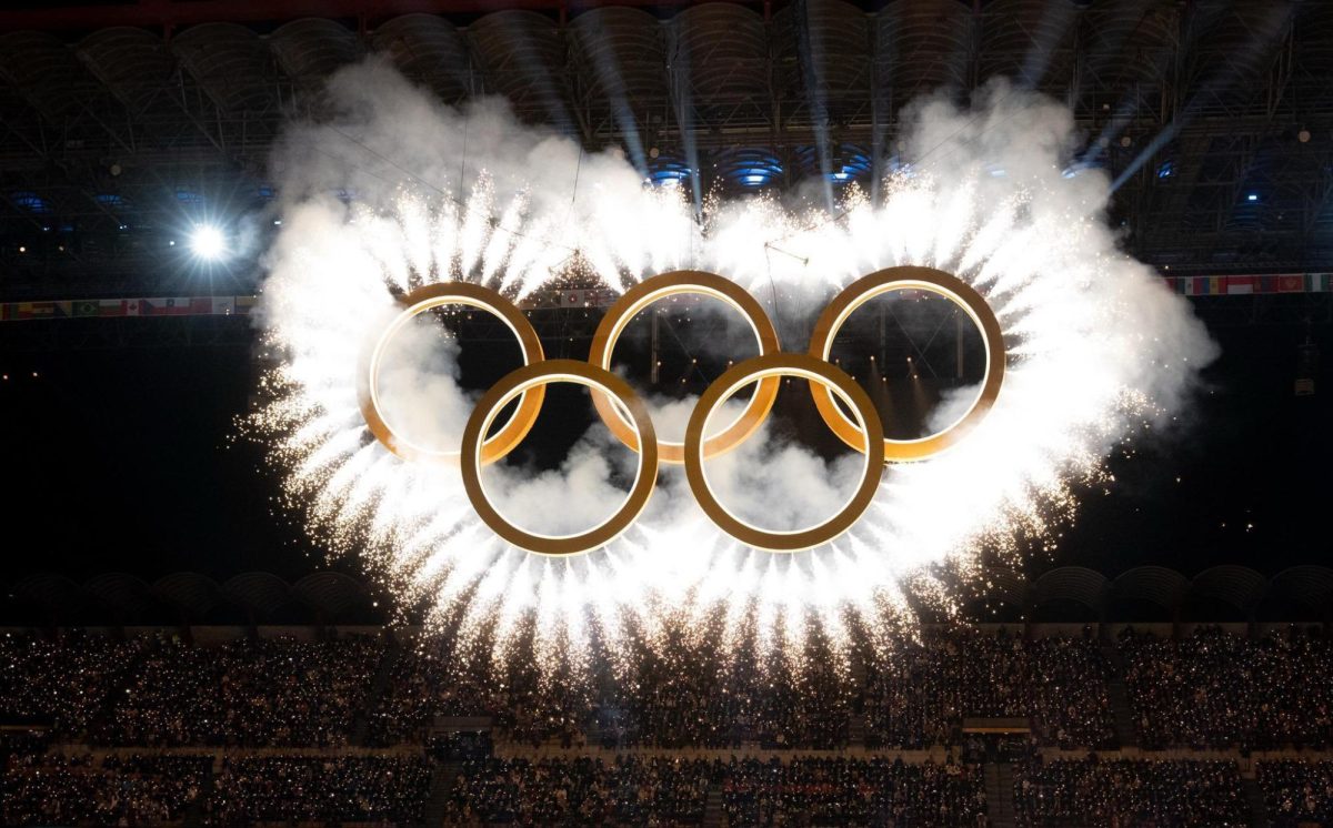 The Olympic rings are unveiled during the opening ceremony of the 2026 Winter Olympics in Milano Cortina. 